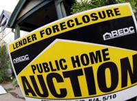 AP - FILE - In this May 9, 2008 file photo, a foreclosure sign stands outside an existing home on ...