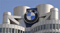 AP - FILE - In this March 18, 2008 file photo the company sign of German car manufacturer BMW is ...