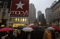 AP - Pedestrians pass Macy's  Saturday, Dec. 26, 2009  in New York. Deal-hunting shoppers headed to America's malls ...