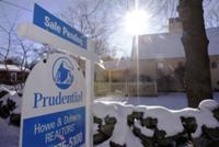 AP - In this Dec. 22, 2009 photo, a sale pending sign is posted over a realtor's sign outside a ...