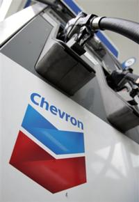 FILE - In this July 31, 2009 file photo, a Chevron gas station pump is shown in Vallejo, Calif.Chevron Corp. said Tuesday, March 9, 2010, it will cut 2,000 jobs this year and will continue reducing its work force through 2011.(AP Photo/Paul Sakuma, file)