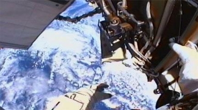NASA astronauts take on seven-hour spacewalk