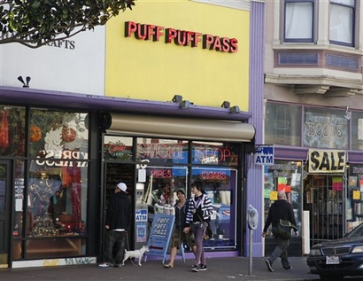 In this file photo, a smoke shop called Puff Puff Pass is shown on Haight Street in San Francisco, Jan. 3, 2009. Counterculture pilgrims hoping to catch a whiff of Flower Power still make their way to the corner of Haight and Ashbury streets, where the spirits of Jimi Hendrix and the Grateful Dead rock on in stores offering T-shirts, posters and pot-smoking paraphernalia. Indeed, while other retail enterprises in the cradle of hippie culture are folding, head shops dealing in roach clips, rolling papers and hand-blown water pipes have proliferated on Haight Street -- so much so that a city supervisor has proposed a law to prevent any more from opening. (AP Photo/Eric Risberg)