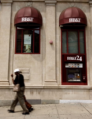 A woman walks past a BB&T branch in the Adams-Morgan neighborhood August 14, 2009 in Washington, D.C. BB&T announced today that it is buying the assests of Colonial BancGroup, an Alabama-based lender, after it is seized by federal banking regulators. (Chip Somodevilla/Getty Images)