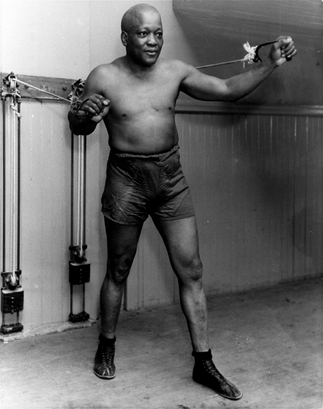 **FILE** Boxer Jack Johnson is shown working out in New York City in this 1932 file photo at the age of 54. Johnson's largely unknown 1911 musings to a French sports magazine, including candid observations on racism likely never intended for American readers, have been translated to English in their entirety for the first time in the new autobiography 'My Life & Battles.' (AP Photo, File)