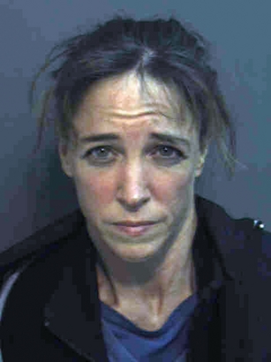 This photo released by the Orange County, Florida jail shows Lisa Marie Nowak, an astronaut who was a mission specialist on a Space Shuttle Discovery flight in 2006. Nowak was arrested February 5, 2006 in Orlando after allegedly driving more than 12 hours from Texas to confront a younger woman who had been dating a fellow astronaut Nowak was also involved with.  (Orange County Jail via Getty Images)