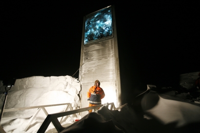 A guard armed with a rifle stands guard Sunday, Feb. 24, 2008 in Longyearbyen, Norway, outside the Svalbard Global Seed  Vault, designed as a safety n