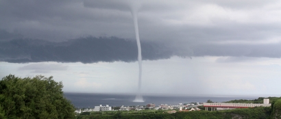 A 'waterspout,' described as a tornado over water, ...