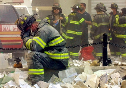 A firefighter breaks down after the World Trade ...