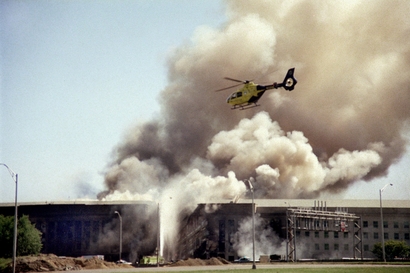 A helicopter flies over the Pentagon in Washington, ...