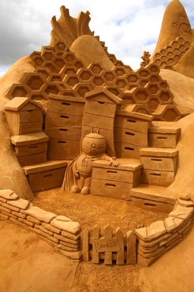 A sand sculpture entitled "The Hive" carved by ...