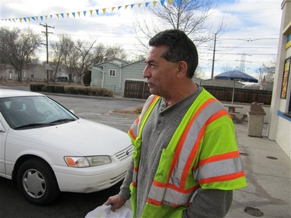 Handyman Joe Martinez of Denver, 55, stops at a hamburger diner for lunch in Denver on Wednesday, Dec. 29, 2010. Martinez works odd jobs, usually lawn