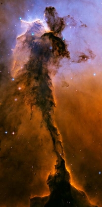 A billowing tower of gas and dust rises from ...
