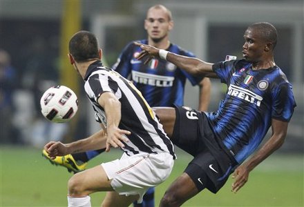 Inter Milan Forward Samuel Eto'o, Of Cameroon, Righ, Challenges For The Ball With Juventus Defender Leonardo Bonucci