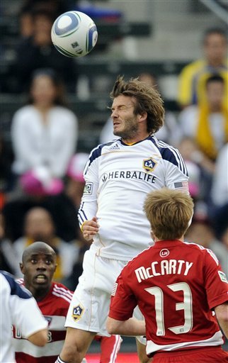 Los Angeles Galaxy Midfielder David Beckham, Top, Heads The Ball As FC Dallas Defender Jair Benitez, Left, And