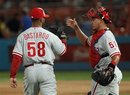 Philadelphia Phillies relief pitcher Antonio Bastardo (58) and catcher Carlos Ruiz celebrate after the Phillies defeated the Florida Marlins 1-0 in a baseball game Monday, July 4, 2011, in Miami.