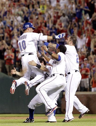 Texas Rangers' Michael Young (10) Leaps