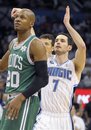 Boston Celtics guard Ray Allen , left, watches as Orlando Magic guard J.J. Redick (7) sinks a  shot late in the second half of an NBA basketball game in Orlando, Fla., Saturday, Dec. 25, 2010. The Magic won 86-78.