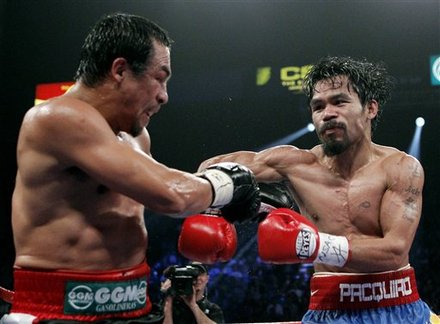 Manny Pacquiao, Right, Of The Philippines, Hits