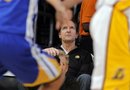 -- CORRECTS NAME OF PERSON -- Peter Guber, one of the owners of the Golden State Warriors , looks on during the Los Angeles Lakers NBA basketball game against the Golden State Warriors, Sunday, Nov. 21, 2010, in Los Angeles.