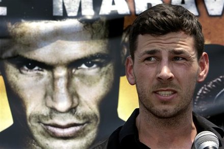 Boxer "Dazzling" Darren Barker, From London, Speaks In Front Of Image Of Opponent Sergio "Maravilla" Martinez, From