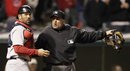 Home plate umpire Dale Scott, right, tells Boston Red Sox catcher Jason Varitek that Cleveland Indians ' Travis Buck is safe at home plate in the sixth inning in a baseball game, Wednesday, April 6, 2011, in Cleveland. Buck scored on a fielders choice for Michael Brantley . The Indians won 8-4.