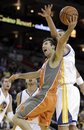 Phoenix Suns ' Steve Nash , center, shoots a layup against Golden State Warriors ' Andris Biedrins during the first half of an NBA basketball game Thursday, Dec. 2, 2010, in Oakland, Calif.