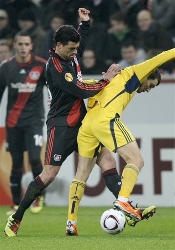Leverkusen's Michael Ballack, Left, And Kharkiv's Denys Oliynyk Challenge For The Ball