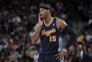 Denver Nuggets small forward Carmelo Anthony (15) stands on the court in the third quarter of an NBA basketball game against the Golden State Warriors in Oakland, Calif., Wednesday, Feb. 9, 2011. The Warriors won 116-114. (AP Photo)