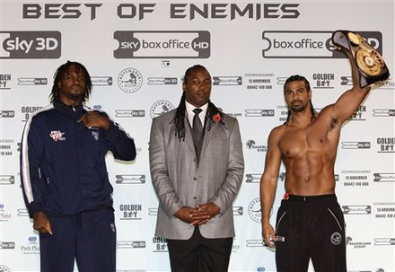 Former World Heavyweight Boxing Champion Lennox Lewis, Center, Stands