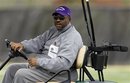 In this Friday, April 8, 2011 photo, East Carolina football coach Ruffin McNeill drives a golf cart around the practice field during NCAA college football spring practice in Greenville, N.C. The former Pirates' defensive back has lost 90 pounds since having weight-loss surgery in January. Next up is hip replacement surgery later this month, which will allow 