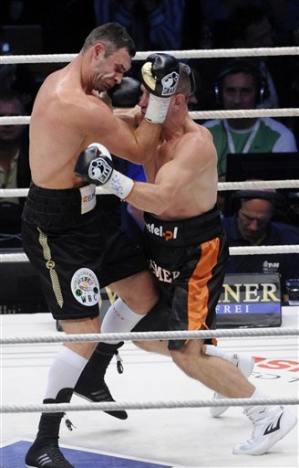 WBC Heavyweight World Champion Vitali Klitschko Of Ukraine, Left,  Fights