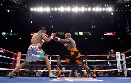 Victor Ortiz, Left, And Floyd Mayweather Exchange Punches