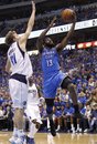 Oklahoma City Thunder guard James Harden (13) shoots against Dallas Mavericks forward Dirk Nowitzki (41) of Germany during the second half of Game 2 of the NBA basketball Western Conference finals Thursday, May 19, 2011, in Dallas. The Thunder won 106-100.