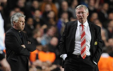 Manchester United's Manager Alex Ferguson, Right, Watches As His Player Raphael Is Carried Off, Not Seen, Flanked By