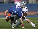 Kansas quarterback Jordan Webb (2) is sacked by Kansas State defensive end Meshak Williams (42) during the first half of an NCAA college football game in Lawrence, Kan., Saturday, Oct. 22, 2011.