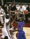 Florida's Kenny Boynton attempts a shot past the defense of Florida State 's Michael Snaer and Bernard James, left, in the second half of an NCAA college basketball game which Florida won 55-51 on Sunday, Nov. 28, 2010, in Tallahassee, Fla.