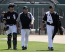 Chicago White Sox starting pitcher Mark Buehrle(notes), right, pitching coach Don Cooper, center, and catcher A.J. Pierzynski(notes) walk to the dugout before the White Sox&#39;s spring training baseball game against the San Francisco Giants on Wednesday, March 16, 2011, in Glendale, Ariz.