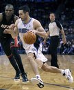 Orlando Magic guard J.J. Redick drives past Miami Heat forward James Jones , left, during the second half of an NBA preseason basketball game, Wednesday, Dec. 21, 2011, in Orlando, Fla. The Magic won 104-100.