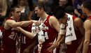 Wisconsin's Josh Gasser (21) jokes with teammates in the closing seconds as they defeat Northwestern 78-45 during an NCAA college basketball game in Evanston, Ill., Sunday, Jan. 23, 2011.