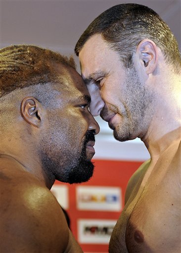 WBC World Champion Vitali Klitschko Of The Ukraine, Right, And Challenger Shannon Briggs Of The U.S. Stand Face To Face