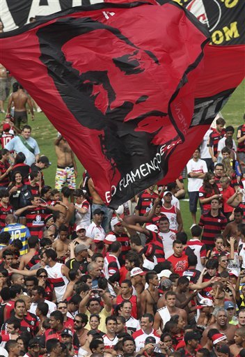 Fans Of Ronaldinho Wave A Flag With His