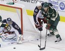 Columbus Blue Jackets ' Rostislav Klesla (97), of the Czech Republic, tries to stop a shot by Minnesota Wild 's Andrew Brunette , right, which Blue Jackets goalie Mathieu Garon , left, blocked in the first period of an NHL hockey game Saturday, Oct. 16, 2010, in St. Paul, Minn.