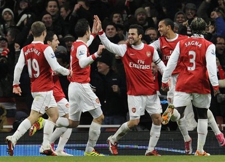 Arsenal's Cesc Fabregas, Center, Celebrates