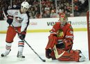 Chicago Blackhawks goalie Marty Turco(notes) right, makes a save against  Columbus Blue Jackets&#39; Tom Sestito(notes) in the first period of an NHL hockey game in Chicago, Sunday, Dec. 26, 2010.