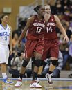 Stanford forward Chiney Ogwumike (13) and teammate forward Kayla Pedersen (14) react to a play during the second half of an NCAA college basketball game against UCLA , Sunday, Feb. 20, 2011, in Los Angeles. Stanford won 67-53.