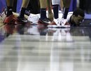 Connecticut guard Shabazz Napier lies on the court after slipping during the second half of the West regional third round NCAA tournament college basketball game against Cincinnati , Saturday, March 19, 2011, at the Verizon Center in Washington. Connecticut defeated Cincinnati 69-58.