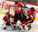 Boston Bruins ' Michael Ryder (73) is checked by Ottawa Senators ' Matt Carkner (39) and David Hale (36) as Senators goaltender Brian Elliott (30) looks on during third-period NHL hockey game action in Ottawa on Saturday, Oct. 30, 2010. Boston defeated Ottawa 4-0.