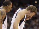 Dallas Mavericks ' Shawn Marion , left, looks on as Dirk Nowitzki , right, holds his left eye after being hit in the face in the second half of an NBA basketball game against the Los Angeles Clippers , Tuesday, Jan. 25, 2011, in Dallas. Nowitzki continued playing in the 112-105 Mavericks win.