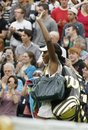 Venus Williams of the US waves to the crowd after defeating Japan's Kimiko Date-Krumm at the All England Lawn Tennis Championships at Wimbledon, Wednesday, June 22, 2011.